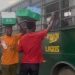 Moment Hawker Gave Money To Occupants Of Prison Bus [VIDEO]