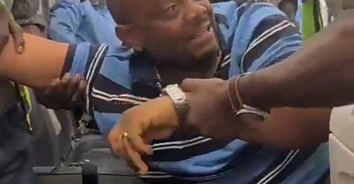 See Moment Man Who Threatened War If Tinubu Is Inaugurated, Was Carried Off Plane For Delaying Flight [PHOTOS+VIDEO]