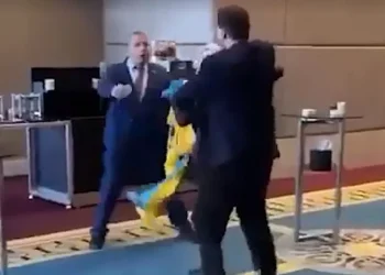 VIRAL VIDEO: Ukrainian MP Punches Russian Representative For Dragging His Country’s Flag From Him At A Conference In Turkey