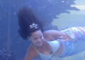 Watch As Mermaid struggles for Air After her ‘tail’ gets caught on the reef inside Aquarium tank [VIDEO]